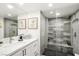 Bright modern bathroom features a single vanity, and a glass enclosed shower with tile surround at 3111 Bel Air Dr # 7F, Las Vegas, NV 89109
