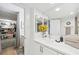 Bright modern bathroom features a double vanity, large mirror, and large walk-in closet at 3111 Bel Air Dr # 7F, Las Vegas, NV 89109
