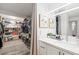 Bright modern bathroom features a double vanity, a large mirror, and a walk-in closet at 3111 Bel Air Dr # 7F, Las Vegas, NV 89109