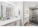 Bright modern bathroom features a double vanity, and a glass enclosed shower at 3111 Bel Air Dr # 7F, Las Vegas, NV 89109