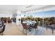 Bright dining area featuring floor-to-ceiling windows with city views, a modern chandelier, and seating for six at 3111 Bel Air Dr # 7F, Las Vegas, NV 89109