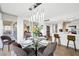 Well-lit dining area with stylish mirror and island seating at 3111 Bel Air Dr # 7F, Las Vegas, NV 89109