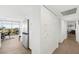 Hallway view with a refrigerator, closet, and an open concept to the living space at 3111 Bel Air Dr # 7F, Las Vegas, NV 89109