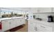 Well-lit kitchen with white cabinetry, stainless appliances and expansive counter space at 3111 Bel Air Dr # 7F, Las Vegas, NV 89109