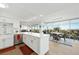 Modern white kitchen open to dining area with city views at 3111 Bel Air Dr # 7F, Las Vegas, NV 89109