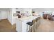 Bright kitchen with island seating and open concept living area at 3111 Bel Air Dr # 7F, Las Vegas, NV 89109