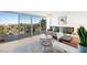 Bright living room featuring a modern aesthetic and large sliding glass doors opening to a balcony at 3111 Bel Air Dr # 7F, Las Vegas, NV 89109