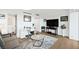 Bright living room area featuring modern decor, desk and office area, and wood flooring at 3111 Bel Air Dr # 7F, Las Vegas, NV 89109