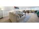 Spacious living room with a wall paneling, comfortable seating, wood floors, and a balcony with city views at 3111 Bel Air Dr # 7F, Las Vegas, NV 89109