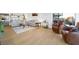Bright living room featuring modern furniture and wood-style tile flooring at 3111 Bel Air Dr # 7F, Las Vegas, NV 89109