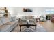 Inviting living room with a comfortable seating arrangement, a coffee table, and access to a balcony at 3111 Bel Air Dr # 7F, Las Vegas, NV 89109
