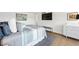 Bright main bedroom features a large window, sitting bench, and hardwood floors at 3111 Bel Air Dr # 7F, Las Vegas, NV 89109