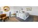 Bright main bedroom featuring a gold mirror and light fixture, an ensuite bathroom, and seating at 3111 Bel Air Dr # 7F, Las Vegas, NV 89109