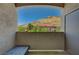 Private balcony featuring mountain views and outdoor seating area at 3320 Cactus Shadow St # 201, Las Vegas, NV 89129
