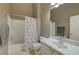 Neutral toned bathroom with shower and tub at 3320 Cactus Shadow St # 201, Las Vegas, NV 89129