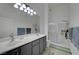 Ensuite bath features double sinks and glass enclosed shower at 3320 Cactus Shadow St # 201, Las Vegas, NV 89129