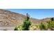 A scenic view of the desert hillsides and local desert vegetation surrounding the neighborhood at 3320 Cactus Shadow St # 201, Las Vegas, NV 89129