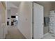 Upstairs hallway and bathroom with shower and tub at 3320 Cactus Shadow St # 201, Las Vegas, NV 89129