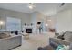 Spacious living room featuring neutral colors, a fireplace, and plenty of natural light at 3320 Cactus Shadow St # 201, Las Vegas, NV 89129