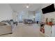 Bright living room featuring vaulted ceilings and neutral-toned decor, promoting a cozy, inviting space at 3320 Cactus Shadow St # 201, Las Vegas, NV 89129
