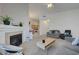Spacious living room showcasing a fireplace and open floor plan into the kitchen area at 3320 Cactus Shadow St # 201, Las Vegas, NV 89129
