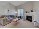 Inviting living room with a fireplace, offering a cozy space for relaxation and entertaining at 3320 Cactus Shadow St # 201, Las Vegas, NV 89129