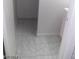 Bathroom entrance featuring tile flooring, white walls, and a view of the space inside at 3435 Villa Knolls South Dr, Las Vegas, NV 89120