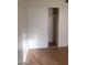 Bedroom featuring wood flooring and a closet with sliding doors, offering ample storage space at 3435 Villa Knolls South Dr, Las Vegas, NV 89120