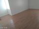 Image shows the flooring, walls, baseboards, and window of the bedroom at 3435 Villa Knolls South Dr, Las Vegas, NV 89120