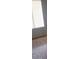 Bright bedroom featuring wood-look flooring and a window with white blinds at 3435 Villa Knolls South Dr, Las Vegas, NV 89120