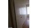 Bedroom with wood-look flooring, window with blinds and neutral paint at 3435 Villa Knolls South Dr, Las Vegas, NV 89120