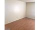 Cozy bedroom featuring hardwood floors and ample natural light, offering a comfortable living space at 3435 Villa Knolls South Dr, Las Vegas, NV 89120
