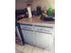 Kitchen featuring gray cabinets, granite countertops, stainless steel appliances, and tiled floors at 3435 Villa Knolls South Dr, Las Vegas, NV 89120