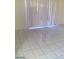 Bright living room featuring large sliding doors and tiled floors at 3435 Villa Knolls South Dr, Las Vegas, NV 89120
