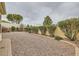 Low-maintenance backyard with gravel groundcover and mature shrubbery at 3473 Conough Ln, Las Vegas, NV 89129