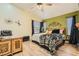 Serene bedroom with modern decor, a ceiling fan, and ample natural light at 3473 Conough Ln, Las Vegas, NV 89129