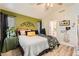 Comfortable bedroom with bright colors, a ceiling fan, and modern decor at 3473 Conough Ln, Las Vegas, NV 89129