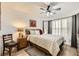 Comfortable bedroom with wood-look flooring and ceiling fan for added relaxation at 3473 Conough Ln, Las Vegas, NV 89129