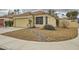 Stunning exterior view of single-story home showcasing desert landscaping, two-car garage and classic tile roofing at 3473 Conough Ln, Las Vegas, NV 89129