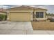 Charming single-story home showcasing a well-maintained lawn, a two-car garage, and a classic tile roof at 3473 Conough Ln, Las Vegas, NV 89129