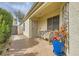 Inviting front porch area with tiled flooring, complemented by tasteful decor and seating for outdoor enjoyment at 3473 Conough Ln, Las Vegas, NV 89129