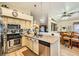 Well-appointed kitchen with granite counters, stainless appliances, open to the dining area, creating a social space at 3473 Conough Ln, Las Vegas, NV 89129