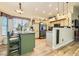 Bright and airy kitchen with granite counters, a kitchen island, and a view of the dining area and living room at 3473 Conough Ln, Las Vegas, NV 89129