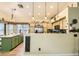 Stylish kitchen featuring wood cabinets and modern lighting fixtures at 3473 Conough Ln, Las Vegas, NV 89129