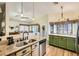 Open-concept kitchen with granite countertops, stainless steel appliances, and a view into the dining area at 3473 Conough Ln, Las Vegas, NV 89129