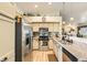 Modern kitchen featuring stainless steel appliances, granite countertops, and ample cabinet space for storage at 3473 Conough Ln, Las Vegas, NV 89129