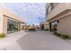 A modern backyard features a reflecting pool, sleek patio, and contemporary architecture at 3510 Cosima Ln, Las Vegas, NV 89120