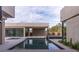 Backyard featuring a reflecting pool, sleek patio, and modern design at 3510 Cosima Ln, Las Vegas, NV 89120