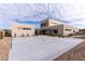 Modern home with clean lines, a spacious driveway, and contemporary landscaping at 3510 Cosima Ln, Las Vegas, NV 89120