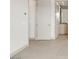 A clean and modern hallway with neutral colors leads to the bathroom at 3510 Cosima Ln, Las Vegas, NV 89120